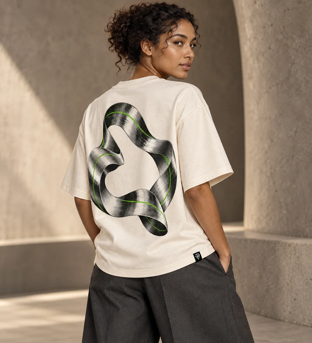 Adult female model wearing the bone ECHO boxy tee with sculptural silver loop artwork